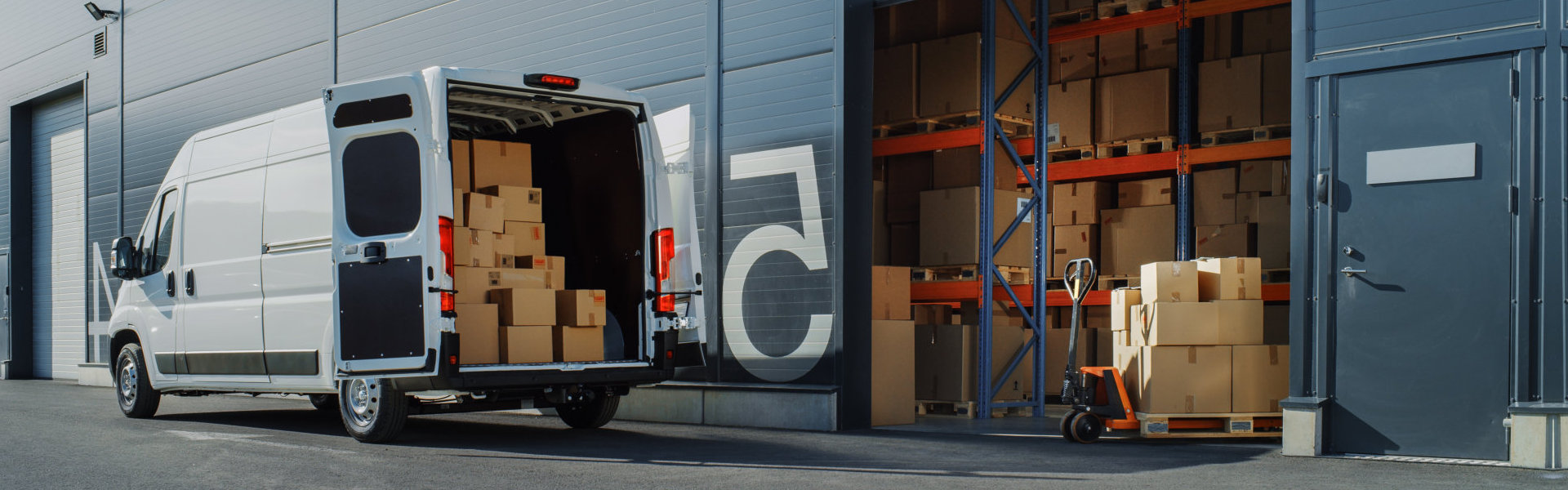 Delivery Van Loaded with Cardboard Boxes